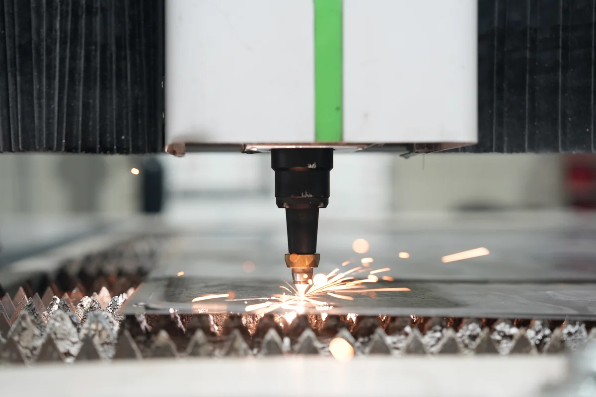 Fibre laser cutting steel for a hydro cabinet on the CryptoMiners floor